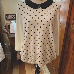 White sweater with Black polka dots & black collar.